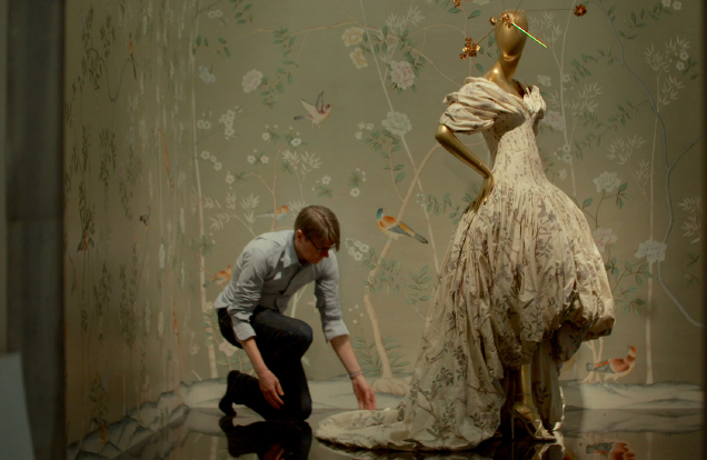 first monday in may, man working on a dress on a mannequin