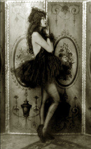 Ziegfeld girl posing with a dress