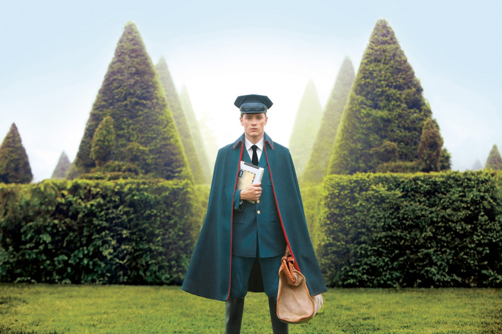 cade martin photography, mailman standing in front of green hedges
