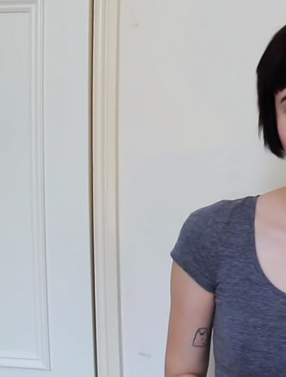 hi i am a slut, slam poetry, woman smiling with gray scoop neck shirt