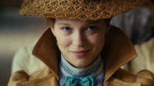 diary of a chambermaid movie, Jeanne Moreau wearing a beige hat and coat, with a blue bowtie