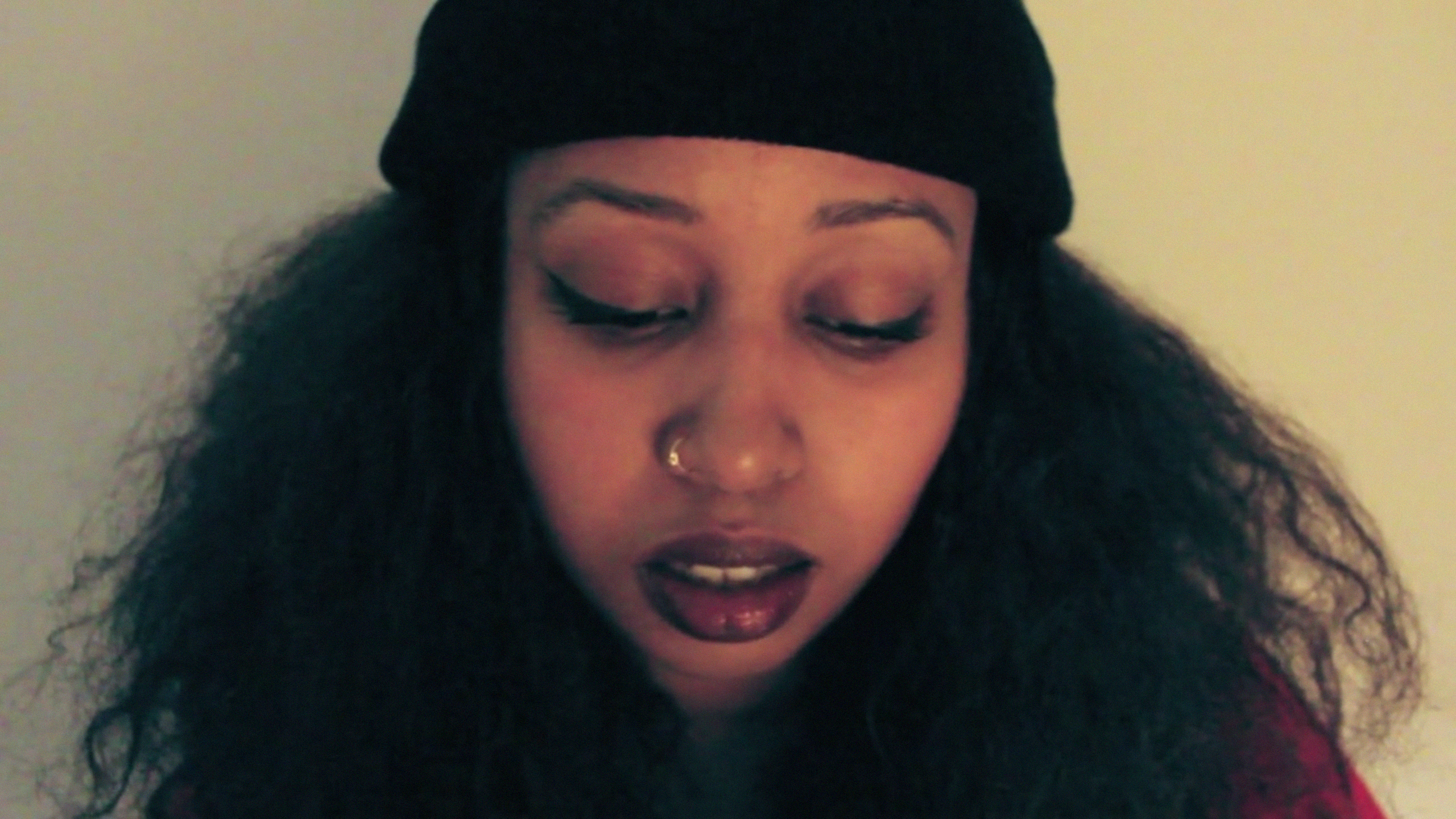 warsan shire portrait, lemonade poet, woman with nose ring and beanie