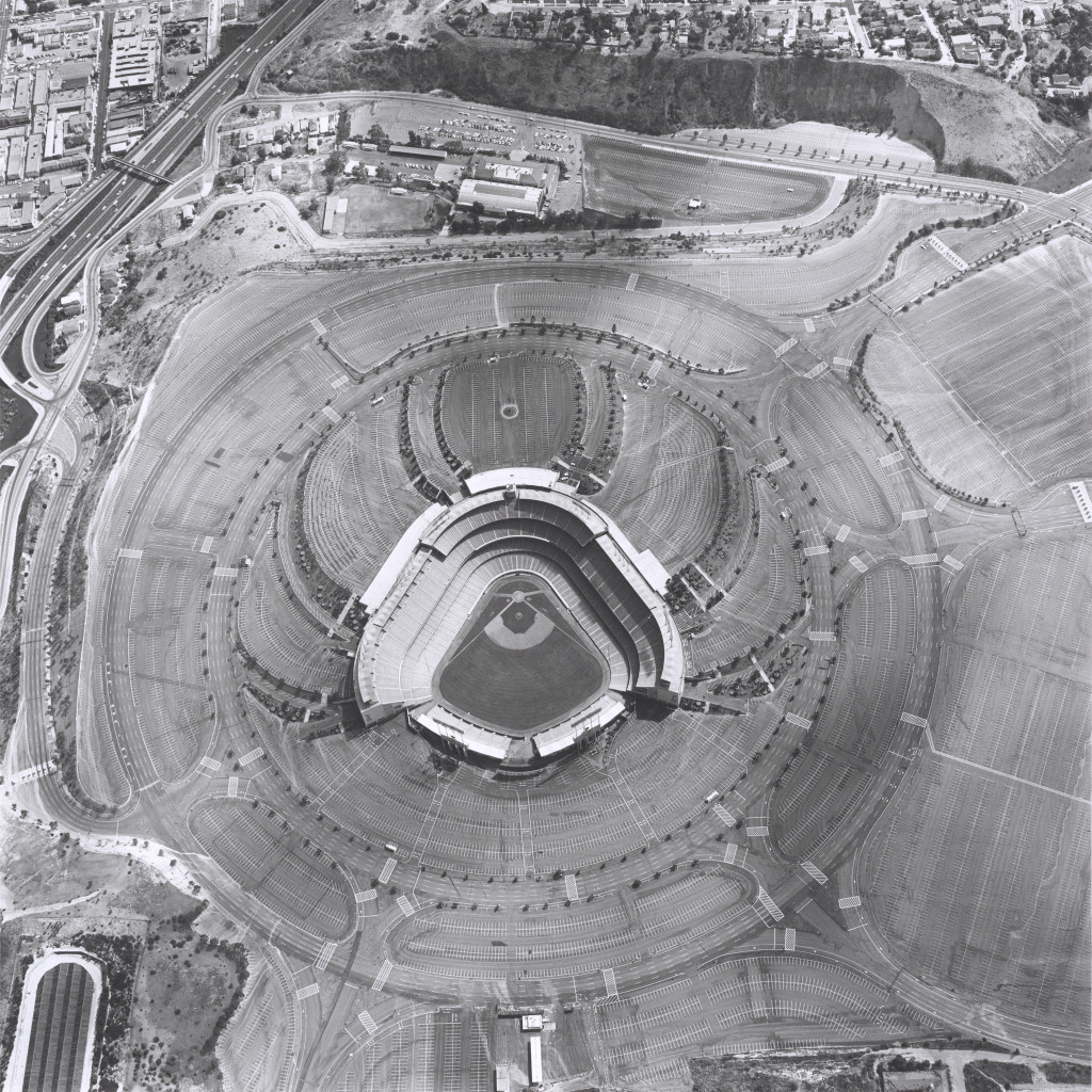 Dodger Stadium, 1000 Elysian Park Ave. (1967), by Ed Ruscha, from the series Parking Lots (1999). Gelatin silver print, 20 x 16 inches. Fine Arts Museums of San Francisco. © Ed Ruscha.