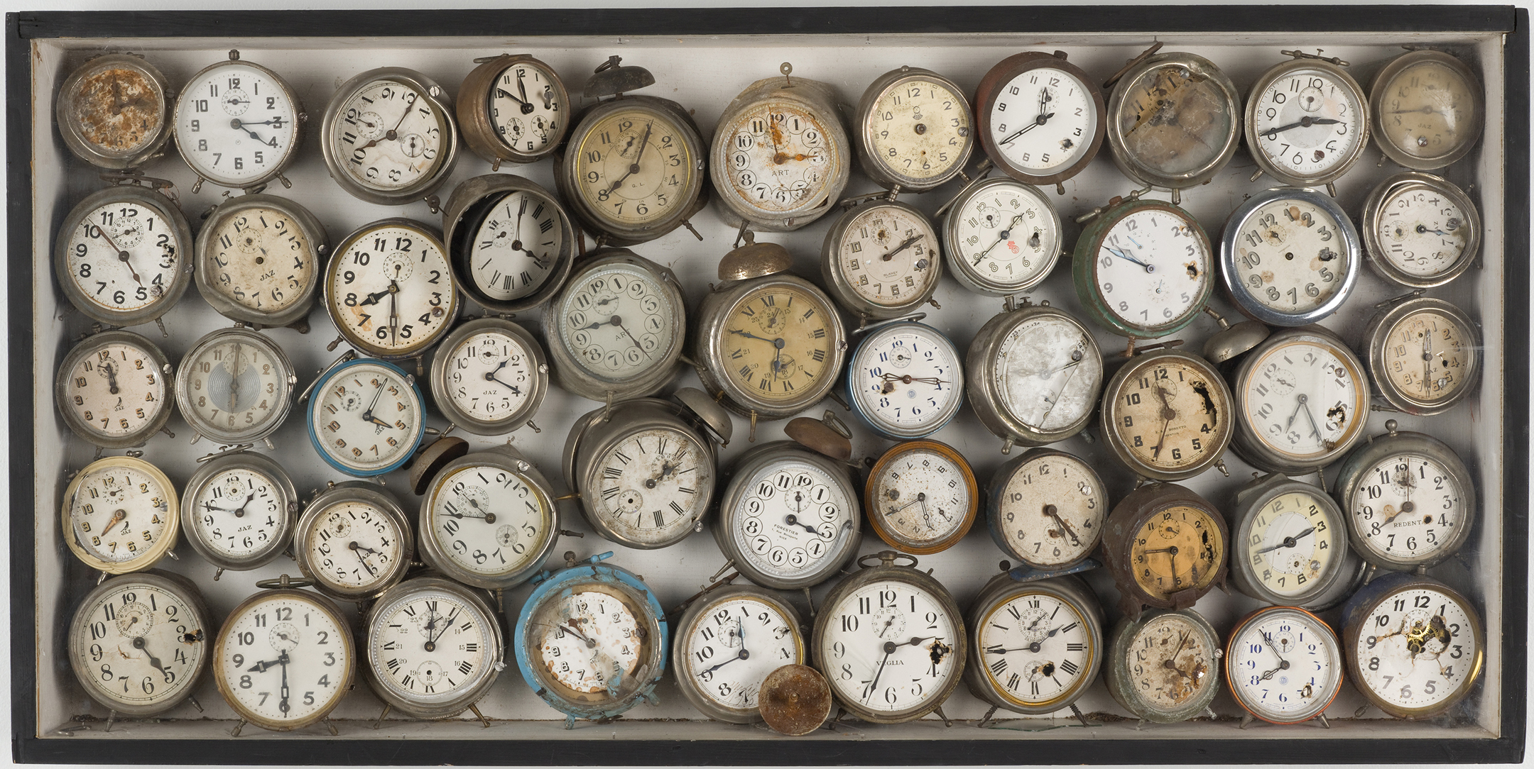 Alarm Clocks (Reveils) (1960), by Arman. Alarm clocks in painted wood box, 23.5 x 47.3125 x 5 inches. Collection Museum of Contemporary Art Chicago.