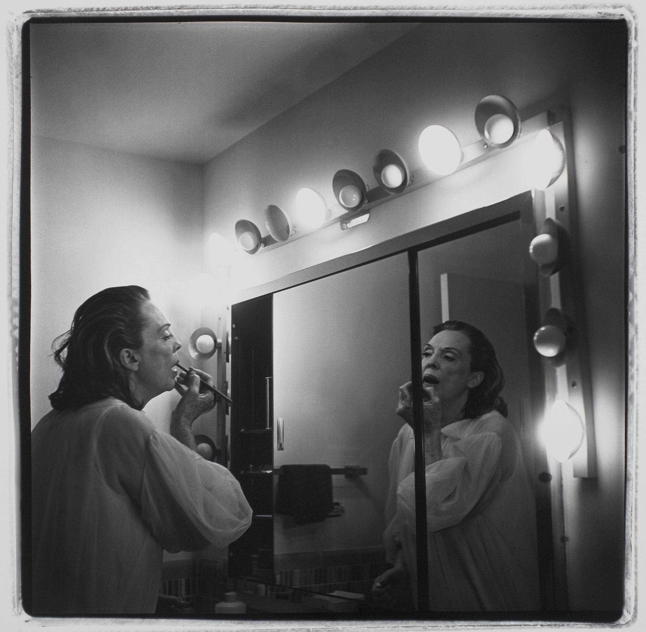 Coral Ridge Towers (Mom Making Up) (1969), by Marilyn Minter. Gelatin silver print, sheet: 16 x 20 inches. Collection of Beth Rudin DeWoody.