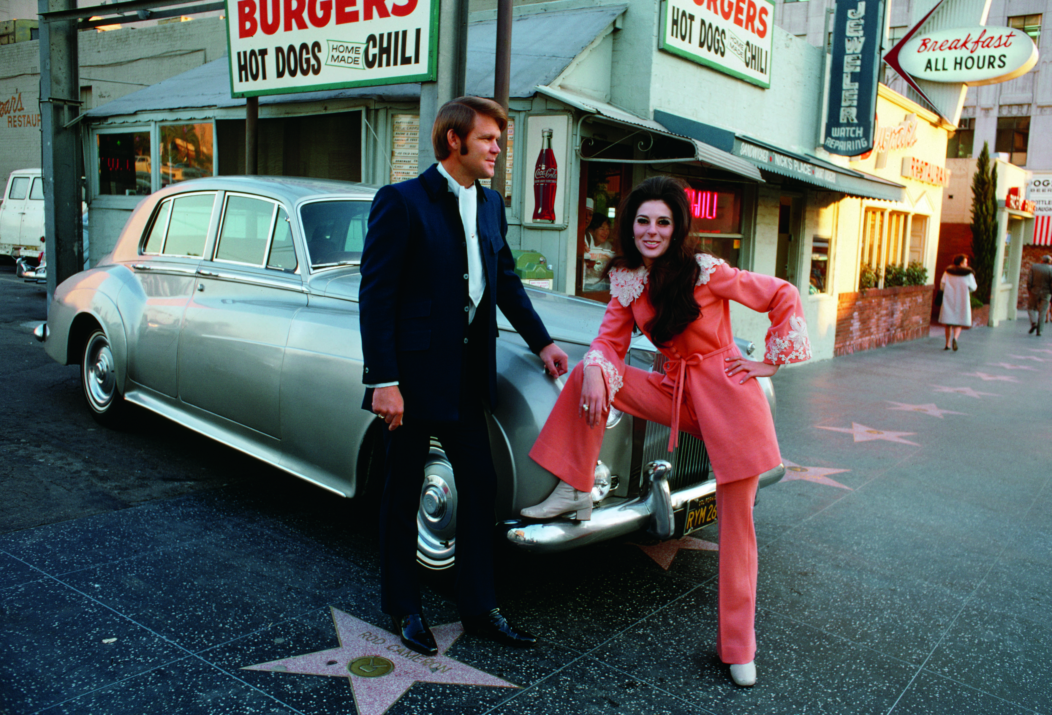 Glen Campbell and Bobby Gentry in front of Nick's Burgers on Hollywood Boulevard. 