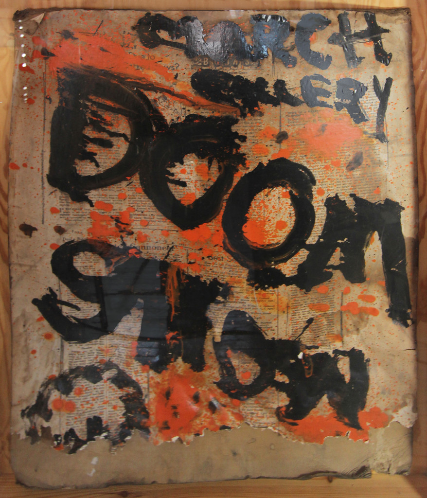 Poster for Doom Show by Sam Goodman (1961), March Gallery, New York. Paint on cardboard in wooden box with Plexiglas,  43 1/2 x 33 x 5 inches.  Boris Lurie Art Foundation, New York. 