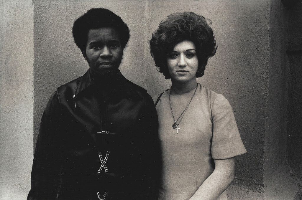 Couple in Front of Church, Los Angeles, 1970. Vintage gelatin silver print. 11 x 14”.
