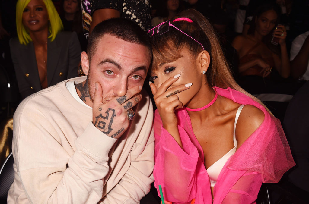 Arianna Grande and Mac covering mouths