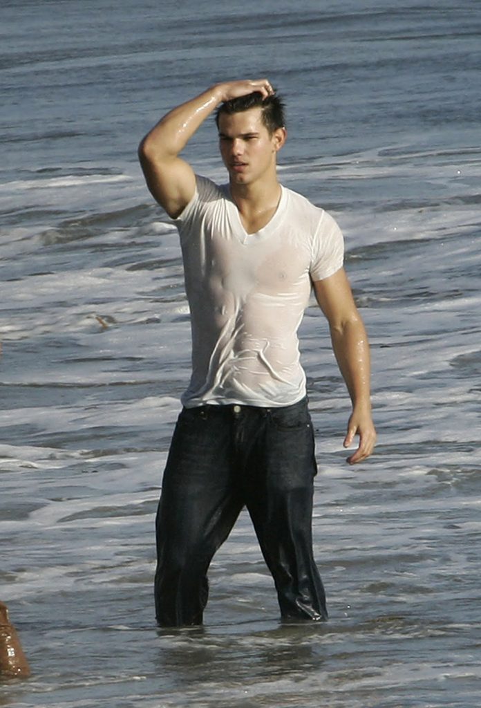 Taylor Lautner looking sexy in a wet white t-shirt