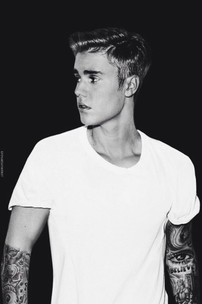 justin bieber in profile and wearing a classic white t-shirt