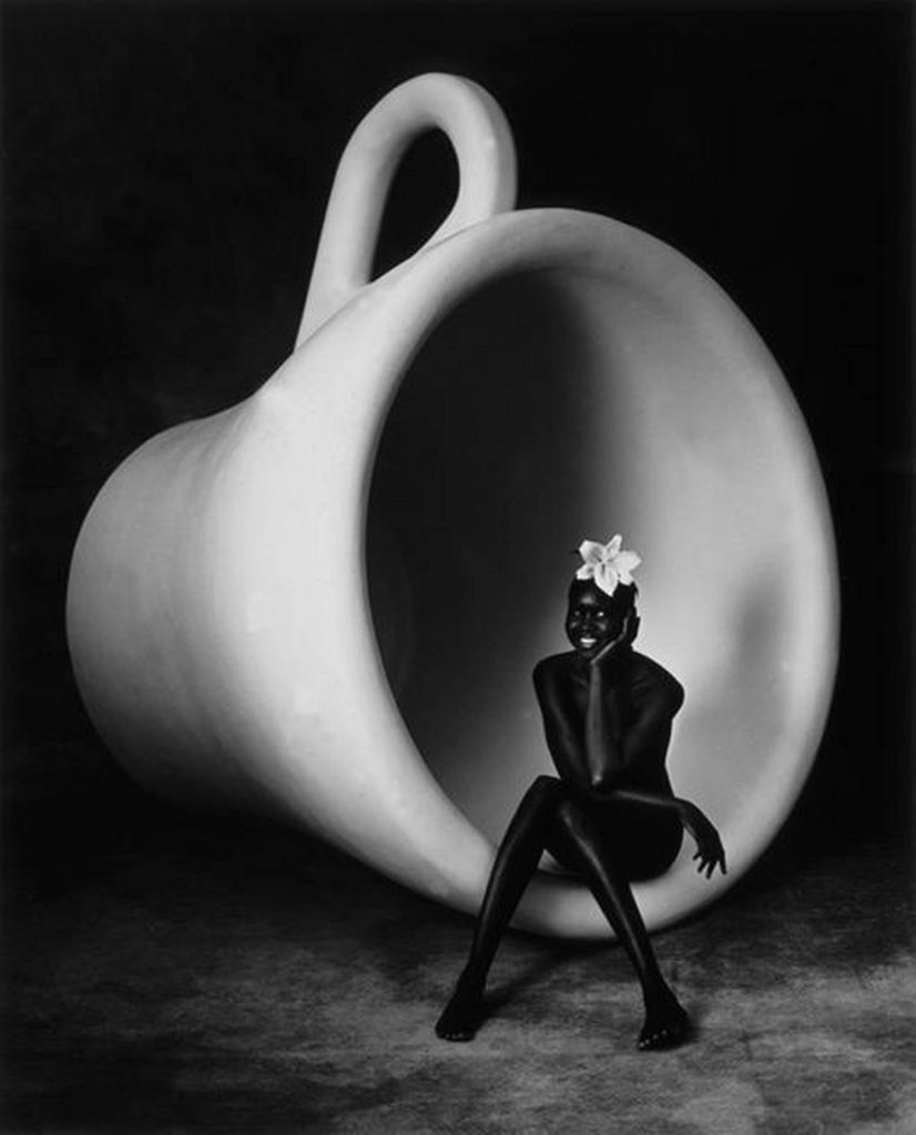Nude Alek in giant coffee cup by Albert Watson