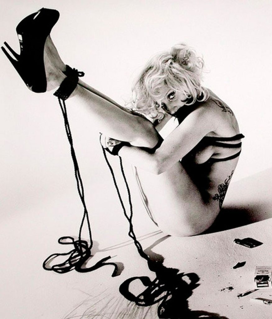 Photograph of Lady Gaga naked and bound by rope wearing black stilettos by Araki