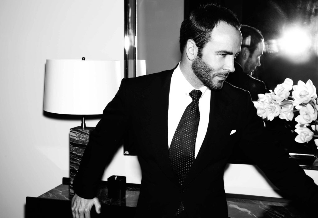 Fashion Designer Tom Ford wearing a black suit, white shirt and tie