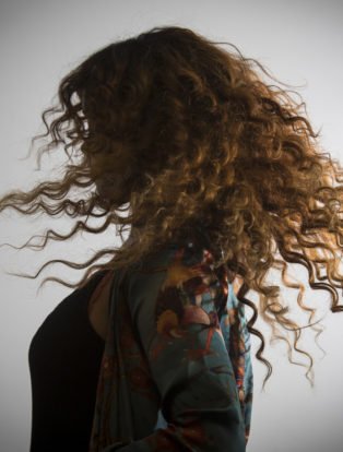 H.E.R. hair twirl