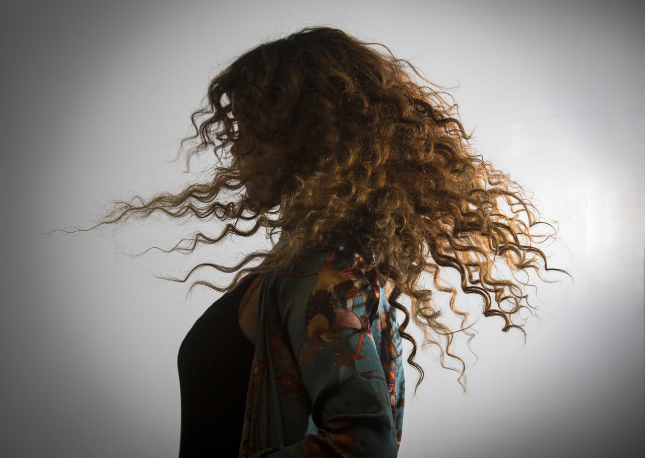 H.E.R. hair twirl
