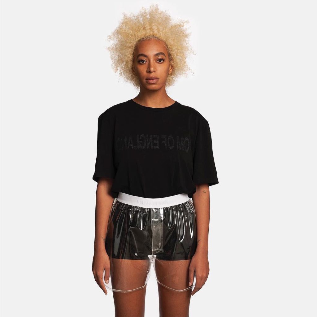 Solange as a model for Helmut Lang in blonde afro and shorts