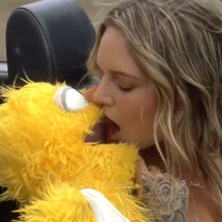 Tove Lo kissing muppet in car