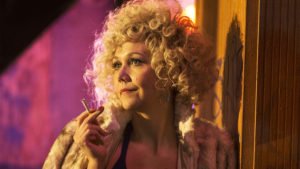 The Deuce Star Candy played by actress Maggie Gyllenhaal wearing one of her blonde afro wigs