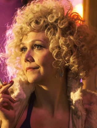 The Deuce Star Candy played by actress Maggie Gyllenhaal wearing one of her blonde afro wigs