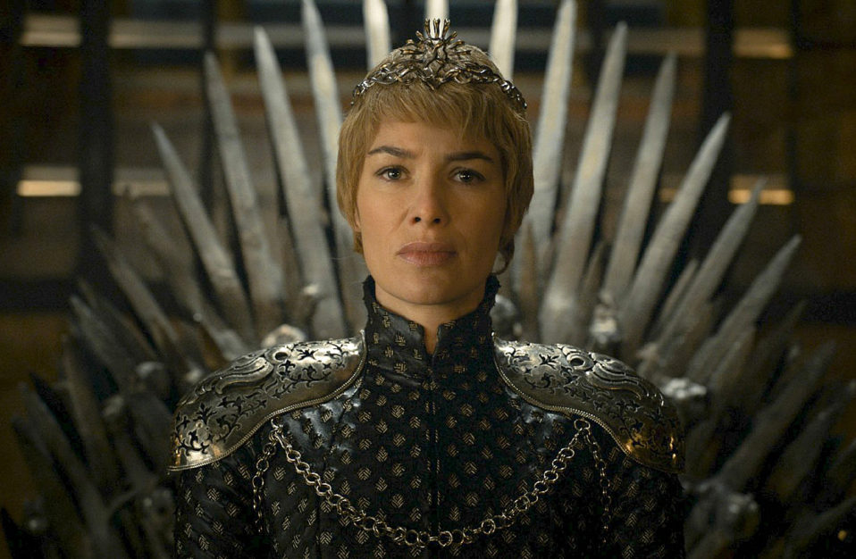 Photo of Lena Headey as Cersei Lannister, the sexiest female villian in HBO Series Game of Thrones- sitting on the throne with short cropped blonde hair wearing a crown.
