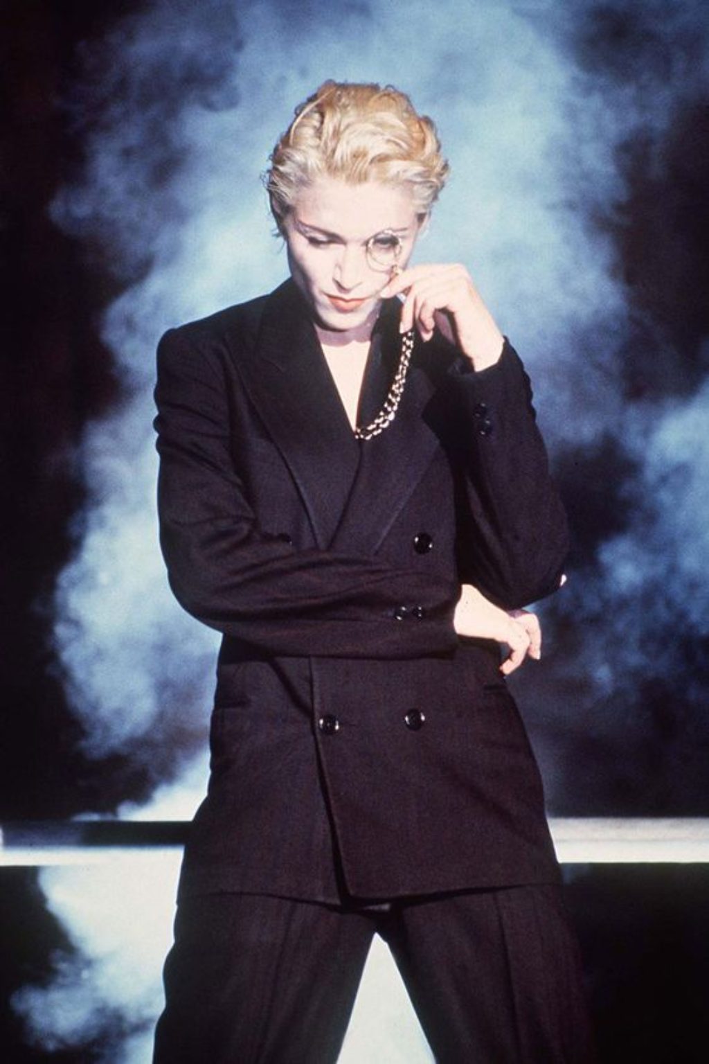 Madonna in black suit and monacle
