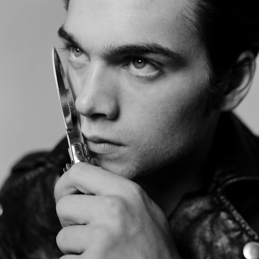 Photographer Tyler Shields Photo of a young man holding a switch blade against his face