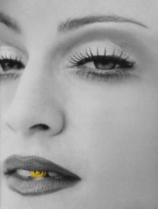 Black and White portrait of madonna with gold front tooth tooth