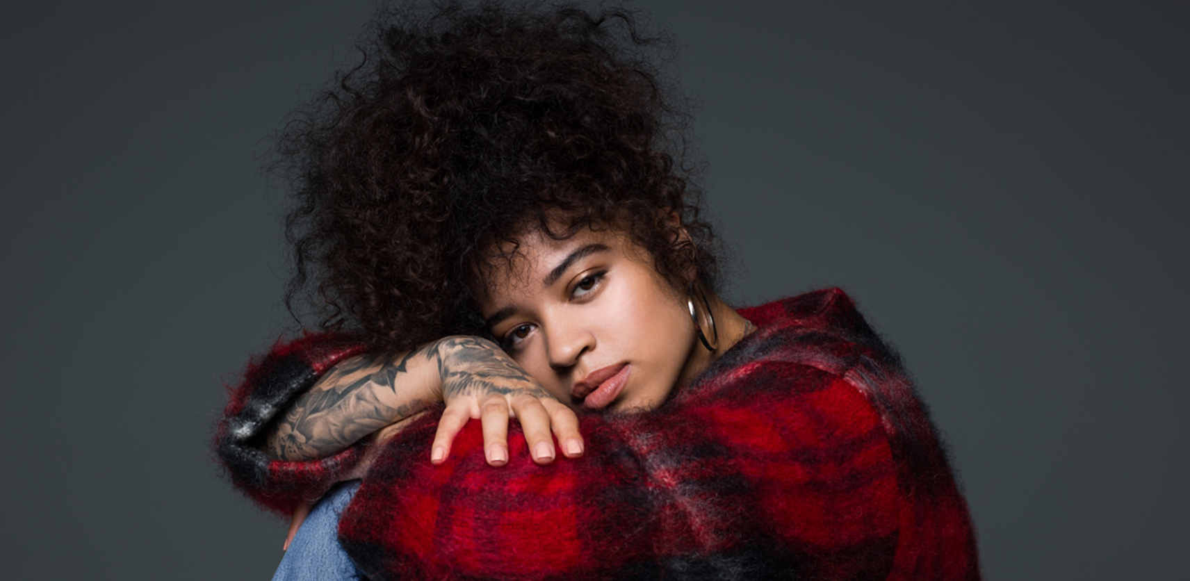 Ella Mai red plaid sitting