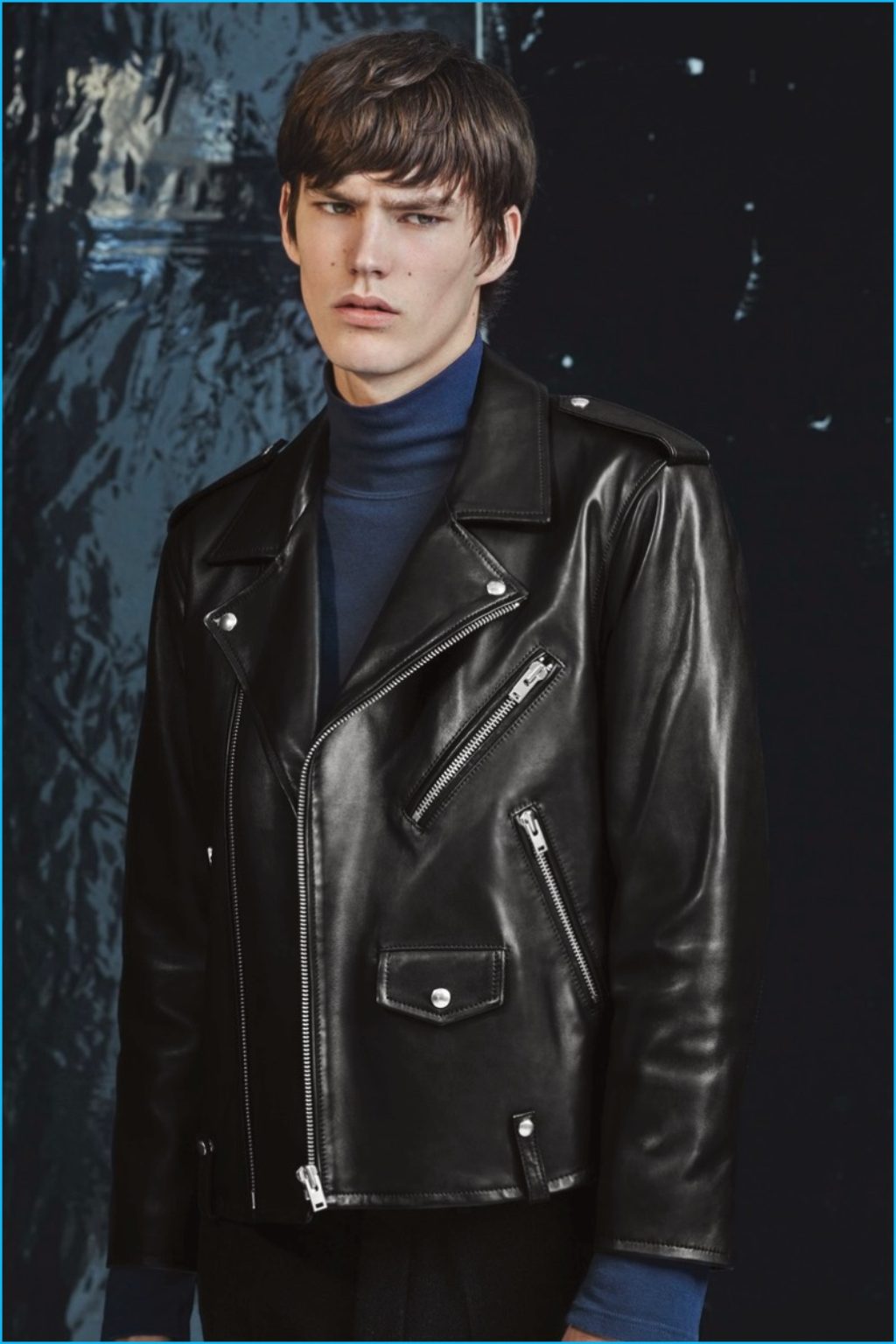Male Model Wearing a Black Leather Motorcycle Jacket and Blue Turtleneck