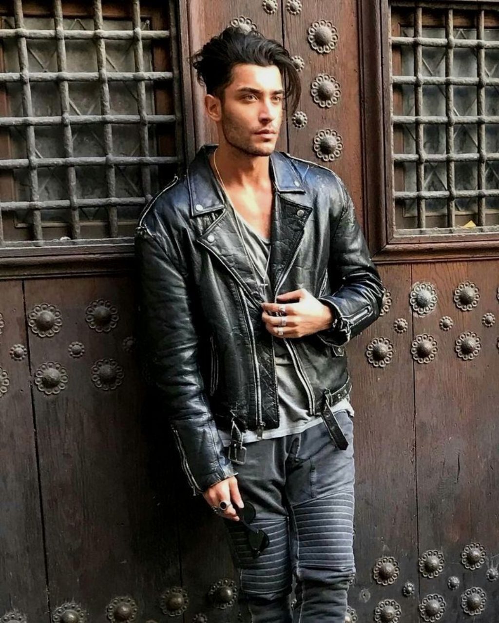Sexy Male Model With Great Hair Wearing a Black Motorcycle Jacket
