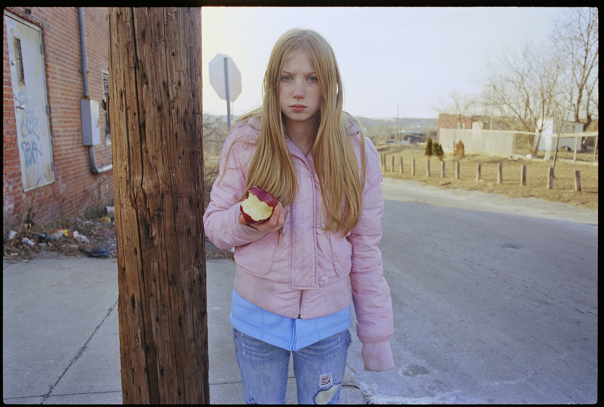 Young girl eating an apple