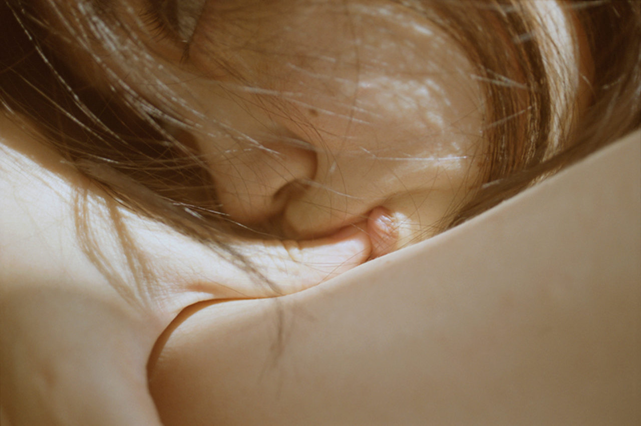 image of an Asian girl sucking her thumb by Li Hui