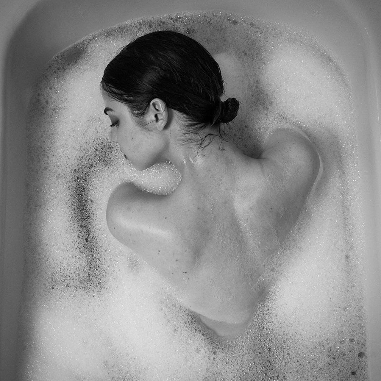 artistic image of a woman taking a bath