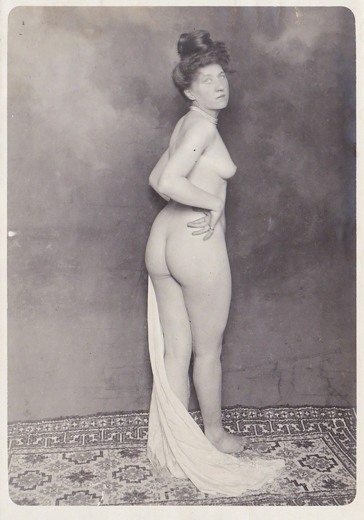 antique photo of a woman at a brothel