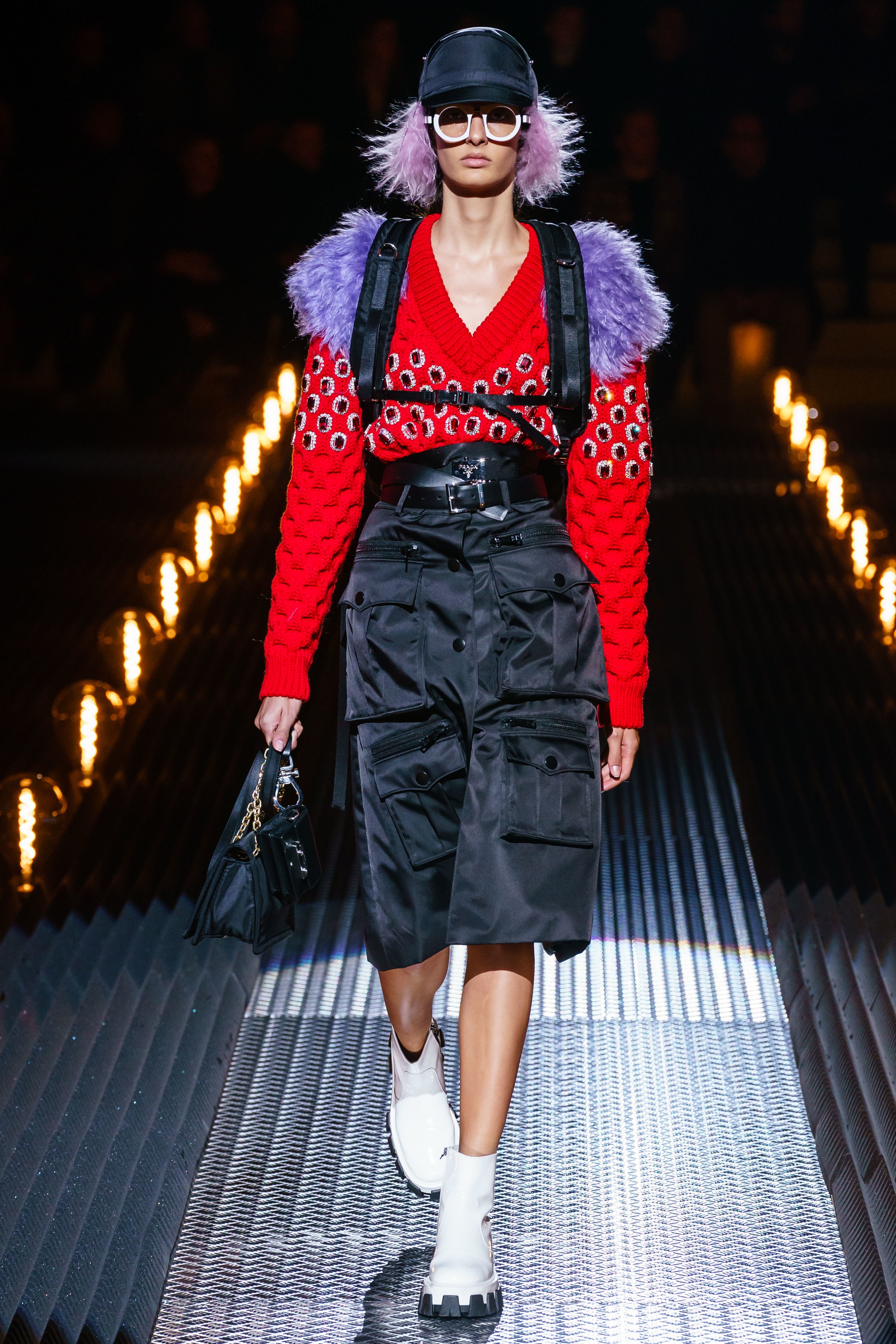 PRADA Men's 2019 Frankenstein Collection Runway Show in Milan Featuring Female Model with Lilac Hair, Lilac fur, White Sunglasses and White Patent Leather Boots