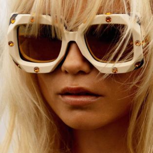 sexiest-fashion-photographers-inez and vinoodh-photo of a blonde model wearing white sunglasses adorned with topaz jewels