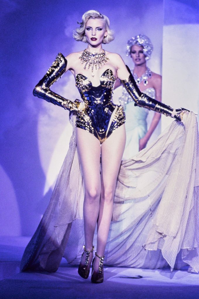 Thierry Mugler Model wearing glamorous metal body armour
