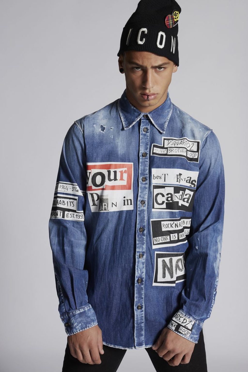 Dsquared2-Spring-Summer-2019-Lookbook photo of male model wearing black hat and jean shirt with printed words .jpg