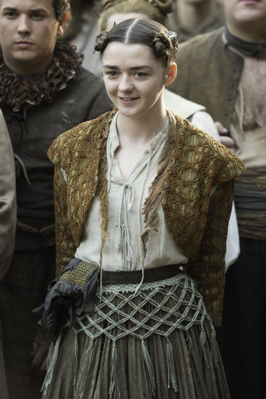Game of Thrones Arya in tight braids and torn sweater