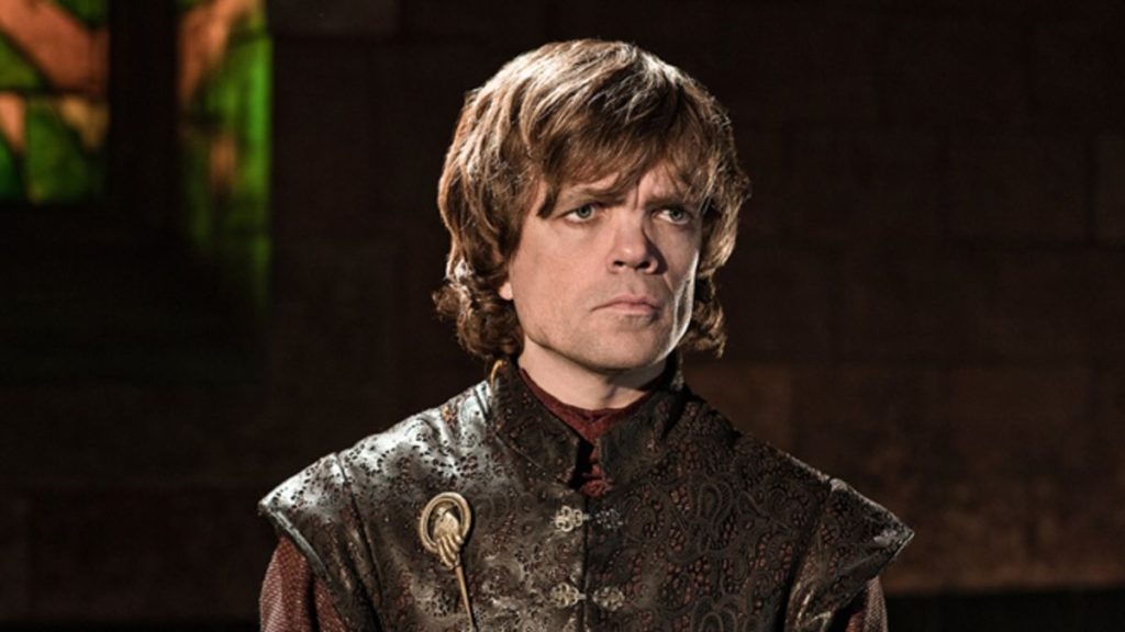 Game of Thrones Tyrion wearing a leather vest and "the hand" pendant