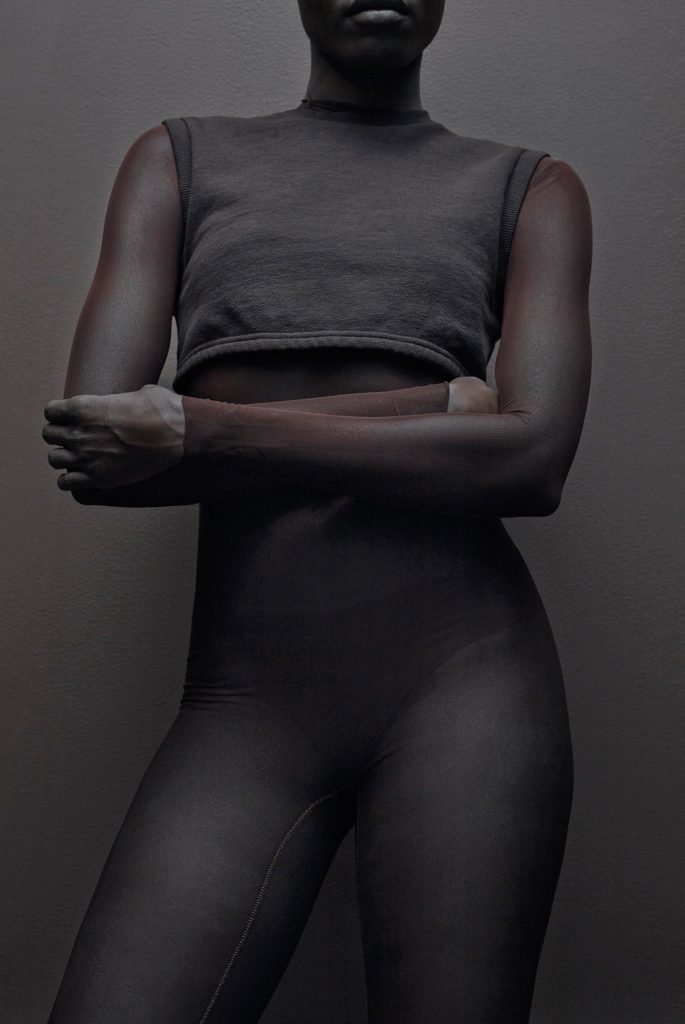 Kanye West Yeezy Zines Model Wearing Cropped Grey top and leggings