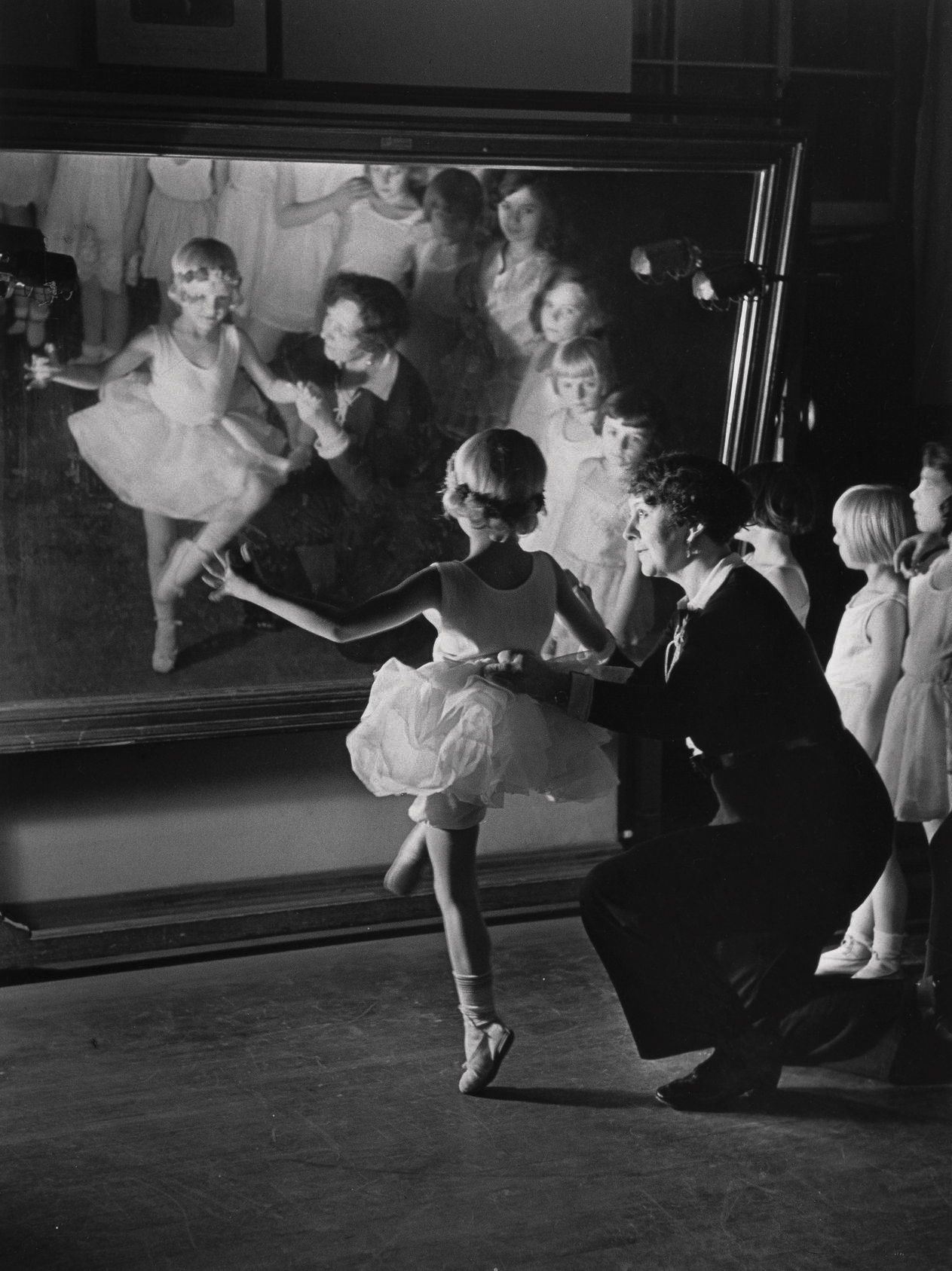 ballet school in berlin, a girl learns in front of a mirror