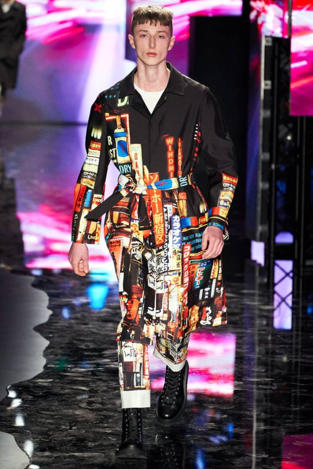 neil_barrett runway model wearing long colorful printed coat-matching pants and combat boots
