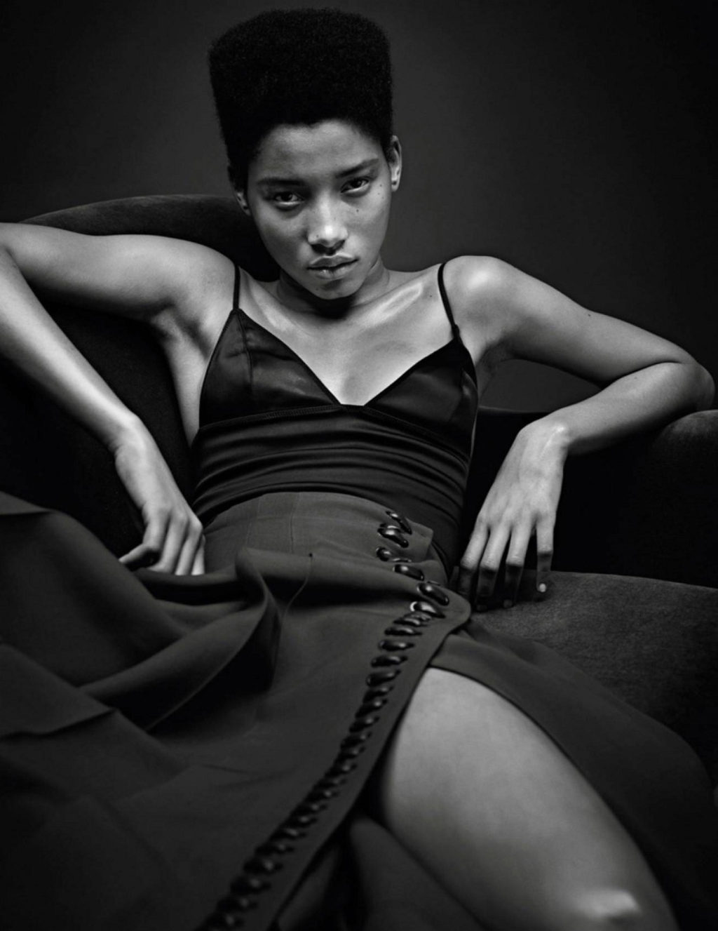 Model wearing dress with her legs spread open