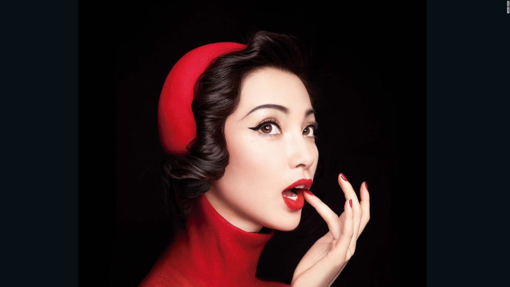 model in red hat-turtleneck, red lipstick and nails-chen-man-1-full-169