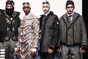 Thom Browne and Moncler Collaboration Image of 4 male models wearing Thom Browne and Moncler Coats