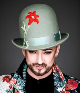 Boy George green hat red flower