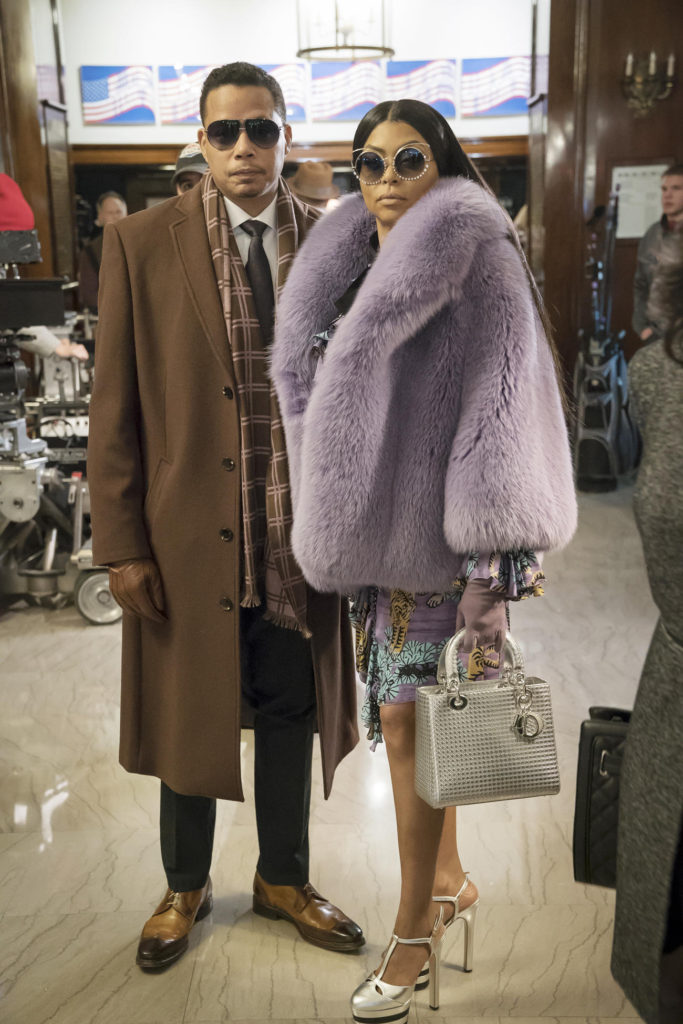 Cookie Lyon wearing lilac fur, over the top shades and white dior bag and silver stilletos with Lucious Lyon wearing Brown Car Coat and Two Tone Brown & Beige Spectator Shoes