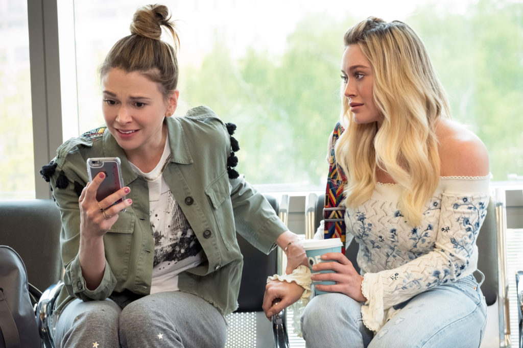 Younger Stars Sutton Foster Wearing Cool Green Military Jacket with Hillary Duff Wearing Sexy Off the Shoulder Floral Top with Flair Sleeves
